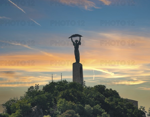 Liberty statue in Budapest on Gellert Hill at sunset