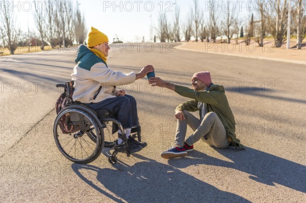 Two friends enjoying a sunny day in the park, sharing warm coffee and laughter, celebrating their