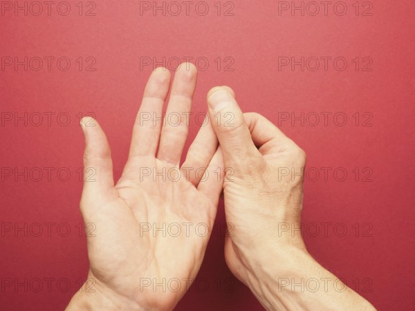 Hand position for mudra no. 3 in Jin Shin Jyutsu, alternative healing method or self-help concept,