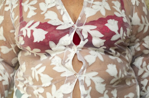 Shirt buttons on stomach of overweight women