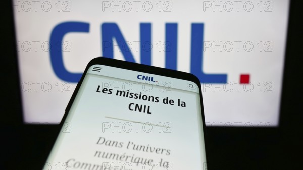 Stuttgart, Germany, 11-21-2023: Smartphone with website of Commission Nationale de l'Informatique