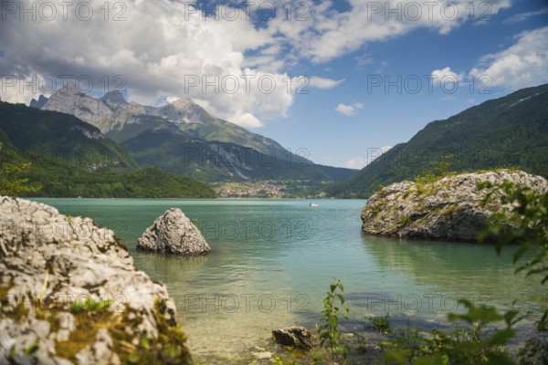 Lake Molveno is nestled between mountains in the Dolomites, Italy, Europe