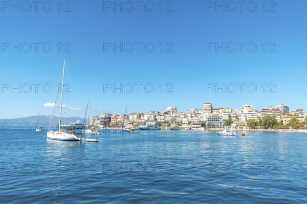 Tourist boats on the beaches of the city of Sarande or Saranda on the Albanian riviera seen from a