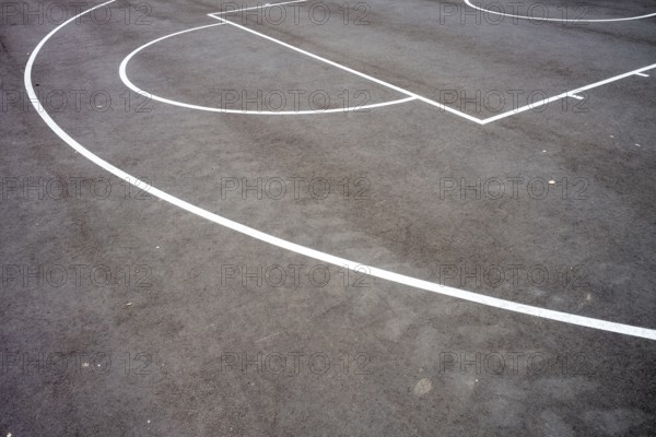 Basketball court lines on the asphalt