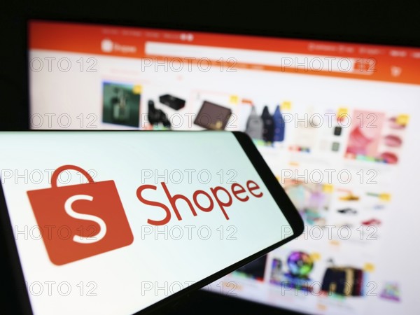 Stuttgart, Germany, 09-10-2022: Cellphone with logo of Singaporean e-commerce company Shopee on