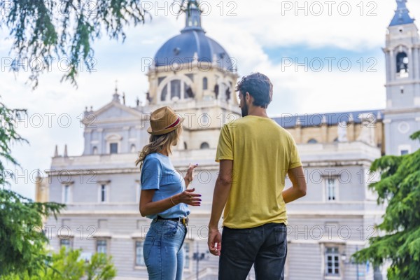 Tourist couple visiting Madrid city on summer vacation. Traveler vacation concept