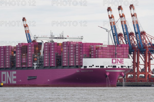 Pink container freighter One Innovation of the shipping company Ocean Network Express (Europe) Ltd.