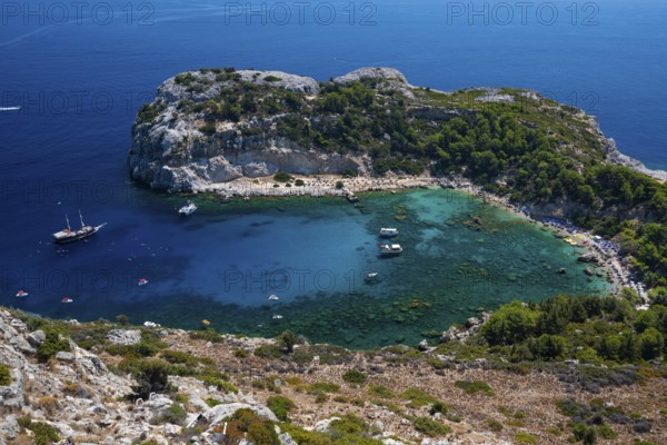Beach umbrellas and sunbeds, turquoise waters, Anthony Quinn Bay, Faliraki, Rhodes, Dodecanese,