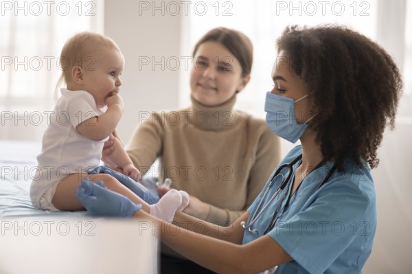 Little baby being health clinic vaccination