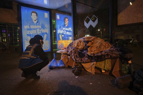 Germany, Berlin, 25.11.2018, cold bus of the Berlin City Mission, sleeping homeless person in a bus