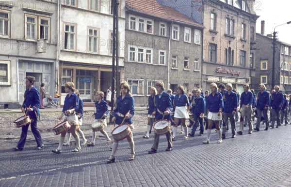 Historical image 1960s or 1970s of a parade in lockstep of the FDJ Freie Deutsche Jugend, free