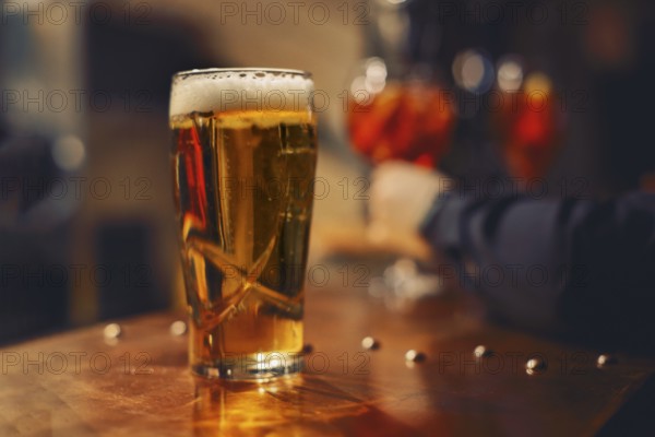 Pint of beer at the bar in a traditional pub. close up