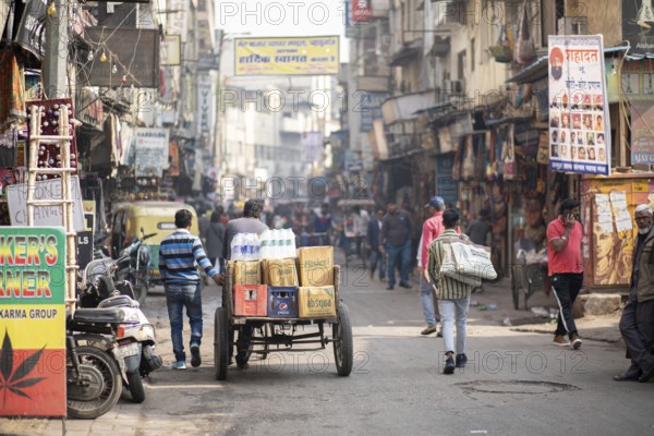 Delhi, India, December 04, 2019: People on busy street at Main Bazaar in Paharganj district, Asia
