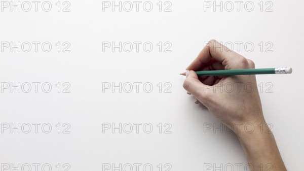 Top view hand holding pencil with copy space. Resolution and high quality beautiful photo