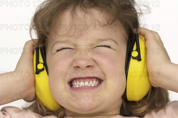 Noise sucks! Child wears hearing protection