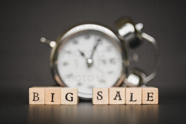 Big sale inscription wooden blocks with clock