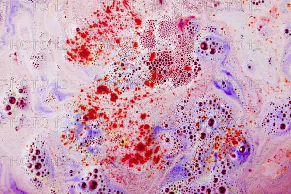 Red purple textured surface with dissolve bathbomb