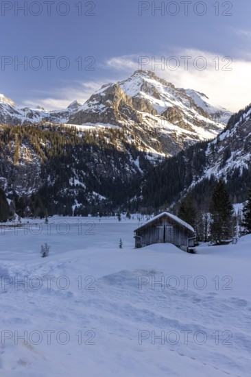 Frozen Lake Lauenen with a view of the Wildhorn and Arpelistock, Lauenen b. Gstaad, Bern,