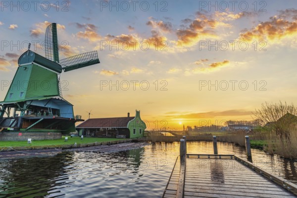 Sunrise at Zaanse Schans village with Dutch Windmill near Amsterdam Netherlands