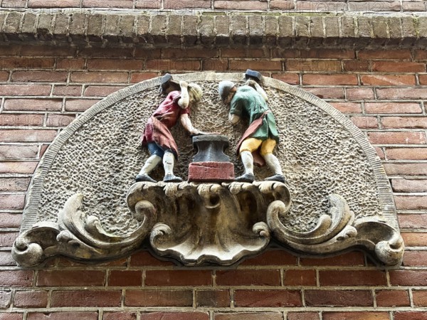 Amsterdam, Netherlands. June 23, 2023. A gablestone of a blacksmith's shop in Amsterdam
