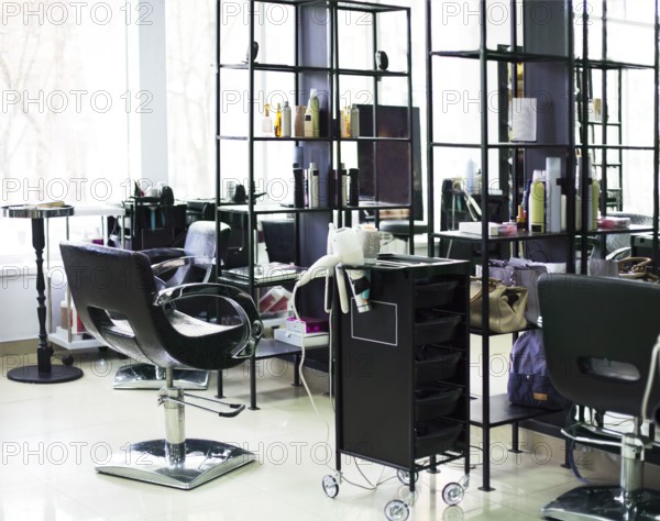 Brand new interior of european beauty salon. Work place of hair stylist