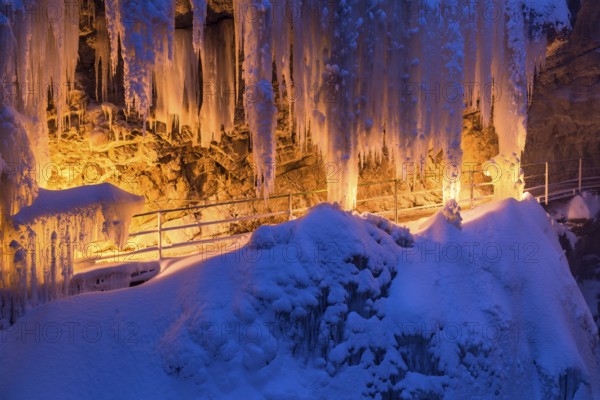 Breitachklamm gorge in winter by torchlight