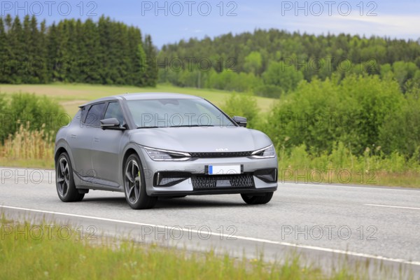 Silver Kia EV6 battery electric car at speed on highway
