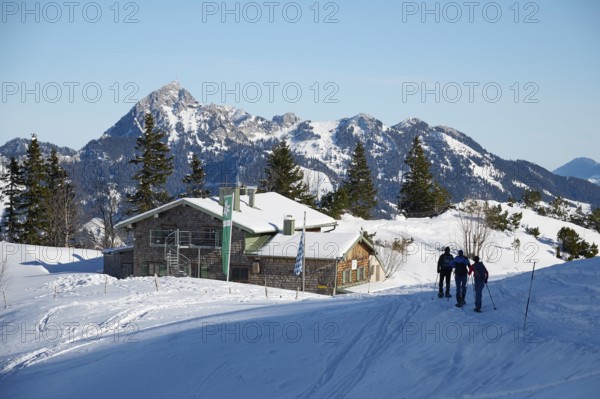 Taubensteinhaus with snowshoe hiker, behind Wendelstein, winter, snow, Spitzingsee, Mangfall