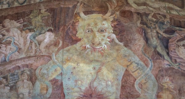 Pisa, Italy, 29 June 2023: Fresco in the Cemetery with Satan and the medieval hell, gothic design,
