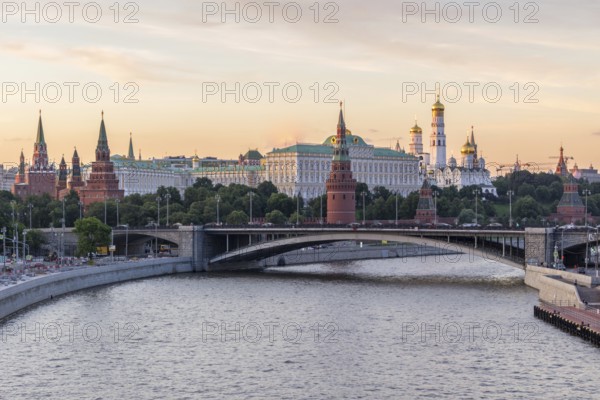 Moscow Kremlin and Moscow River in the sunny evening. Pink and golden sky. Russia
