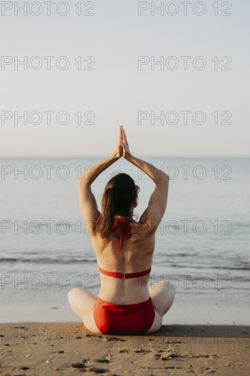 Woman relaxing in a bikini on the beach, Greece, Europe