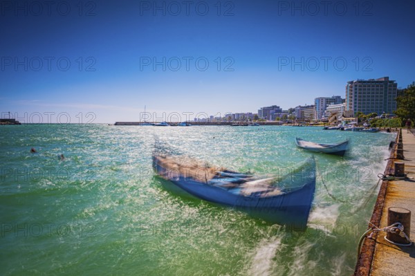 Summer coastal view with boats and hotel buildings in the sunny sky, Golden Sands, Varna, Bulgaria,