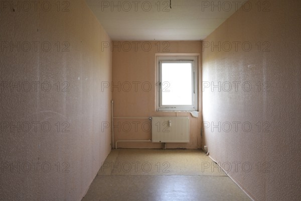 Cramped unrenovated room intended as enough space in a typical rental apartment in social housing