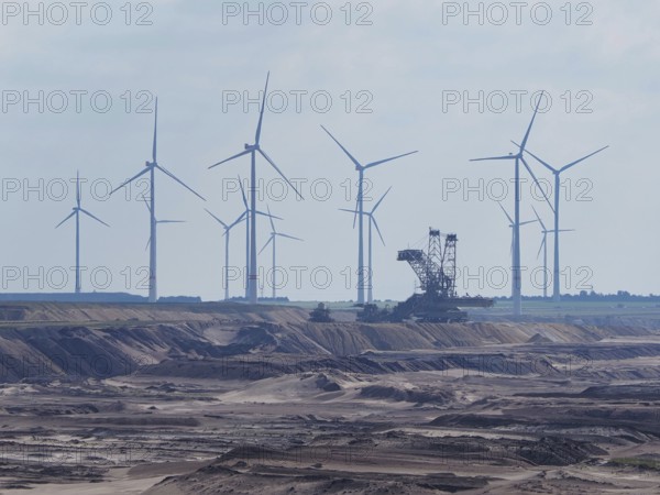 Wind turbine for power generation on the edge of the Garzweiler open-cast lignite mine, in front of