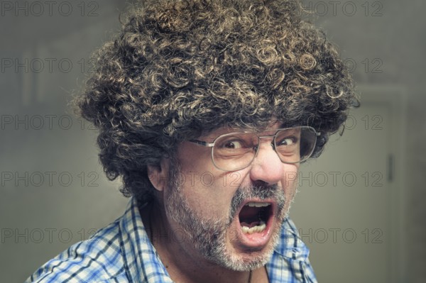 Angry pensioner with a wild wig