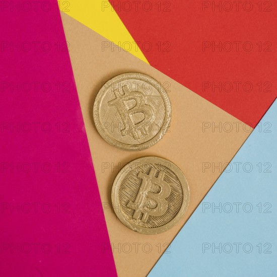 Two bitcoins many colorful background