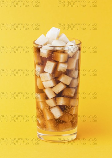 Front view sugar cubes glass with soft drink
