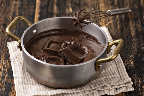 Liquid chocolate cream. Dark background