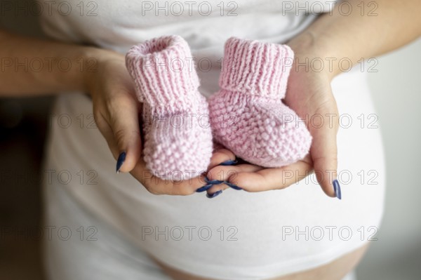 Close up view pink baby shoes