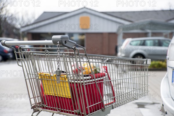 Shopping trolley in the car park of a discount store