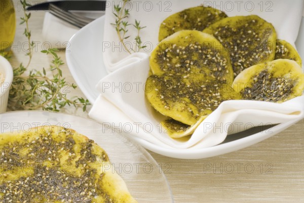 Lebanese manouche or manoushe, lebanese pizza with thyme and sesame seeds, zaatar, and extra virgin