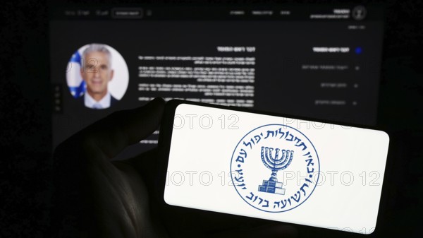 Stuttgart, Germany, 10-29-2023: Person holding smartphone with logo of Israeli national