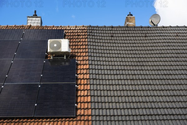 Roofs of a semi-detached house with and without solar panels in Essen, Germany, Europe