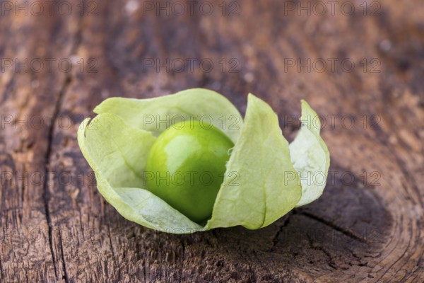 Closeup of a tomatillo on a chopping board