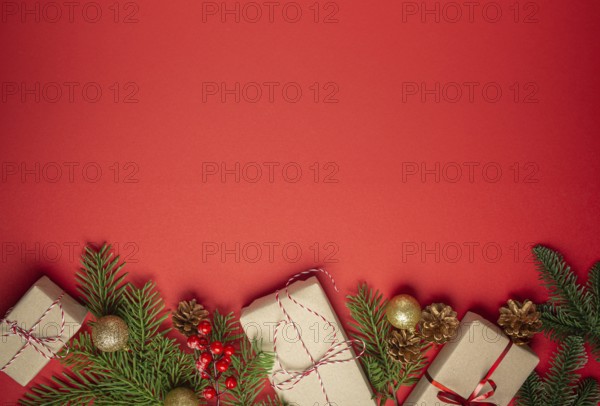Christmas or New Year celebration red paper festive background with decoration fir tree, wrapped