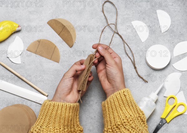 Step 6 Add a string to the inner edge of the ball. Making festive Christmas tree decorations from