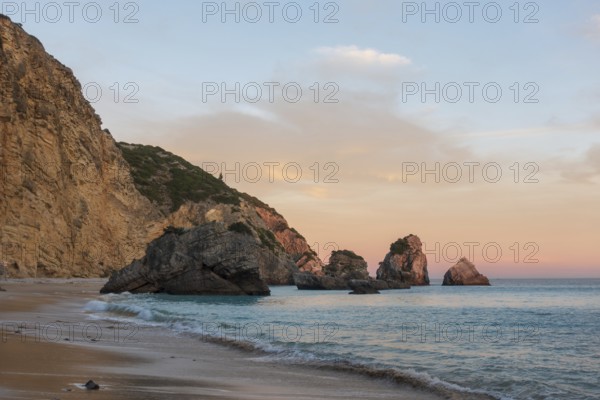 Ribeiro do Cavalo paradise beach in Arrabida Natural Park in Sesimbra at sunset, Portugal, Europe