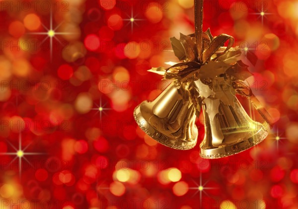 Gold Christmas tree decorations on lights background