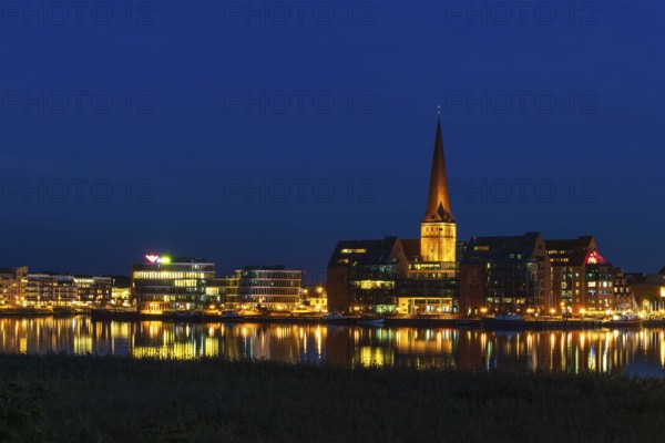 View across the Warnow to the Hanseatic city of Rostock in the evening