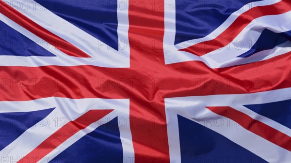 Close-up of a waving flag, national flag of Great Britain, fabric looks like silk